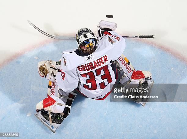 Philipp Grubauer of the Windsor Spitfires stops a shot in the warm-up prior to a game against the London Knights on January 29, 2010 at the John...