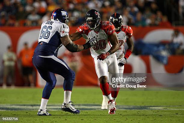 Mario Williams of the Houston Texans in action against David Diehl of the New York Giants plays during the 2010 AFC-NFC Pro Bowl at Sun Life Stadium...