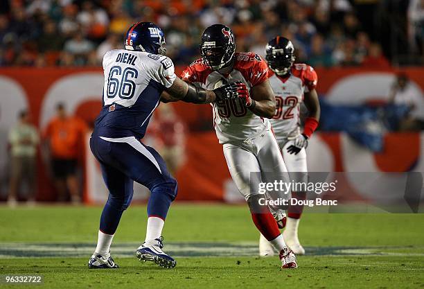 Mario Williams of the Houston Texans in action against David Diehl of the New York Giants plays during the 2010 AFC-NFC Pro Bowl at Sun Life Stadium...