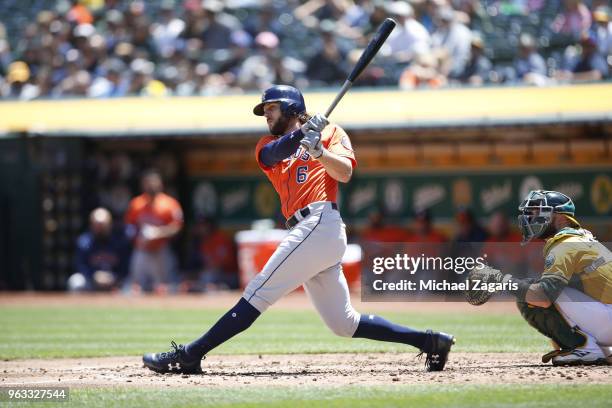 Jake Marisnick of the Houston Astros bats during the game against the Oakland Athletics at the Oakland Alameda Coliseum on May 9, 2018 in Oakland,...