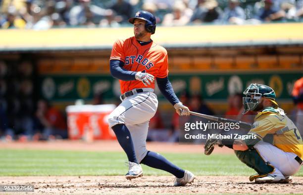 George Springer of the Houston Astros bats during the game against the Oakland Athletics at the Oakland Alameda Coliseum on May 9, 2018 in Oakland,...