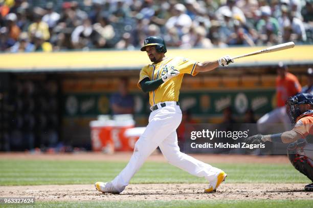 Marcus Semien of the Oakland Athletics bats during the game against the Houston Astros at the Oakland Alameda Coliseum on May 9, 2018 in Oakland,...