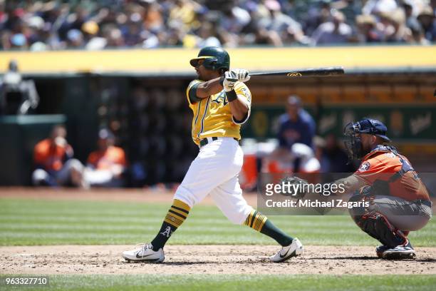 Khris Davis of the Oakland Athletics bats during the game against the Houston Astros at the Oakland Alameda Coliseum on May 9, 2018 in Oakland,...