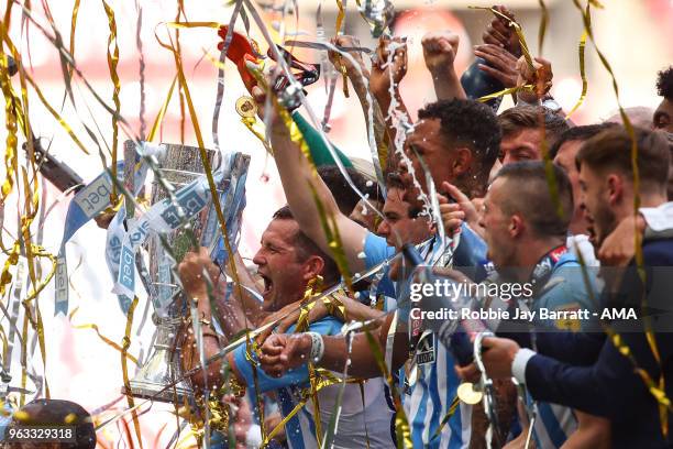 Michael Doyle of Coventry City lifts the EFL Sky Bet League Two play off final trophy with his team mates during the Sky Bet League Two Play Off...