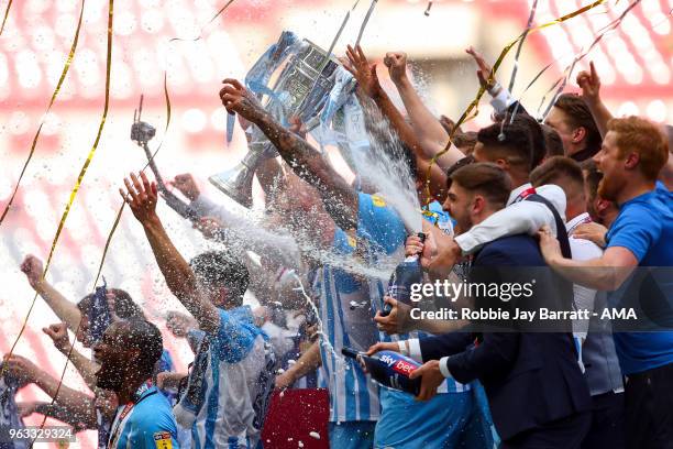 Michael Doyle of Coventry City lifts the EFL Sky Bet League Two play off final trophy with his team mates during the Sky Bet League Two Play Off...