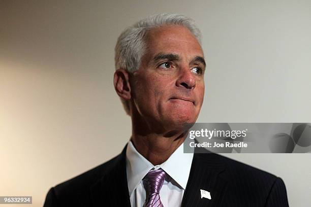 Florida Governor Charlie Crist looks on during a press conference after thanking workers helping Haitian victims of the earthquake in Port-au-Prince...
