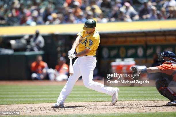 Matt Olson of the Oakland Athletics bats during the game against the Houston Astros at the Oakland Alameda Coliseum on May 9, 2018 in Oakland,...