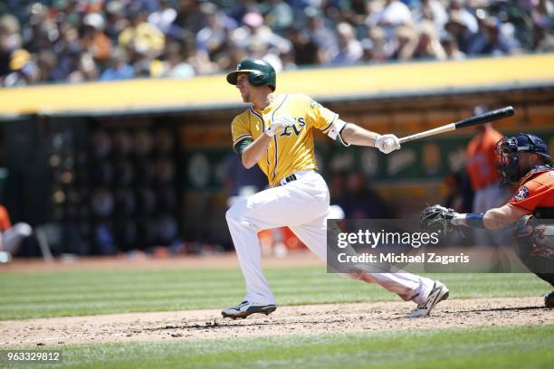 Stephen Piscotty of the Oakland Athletics bats during the game against the Houston Astros at the Oakland Alameda Coliseum on May 9, 2018 in Oakland,...