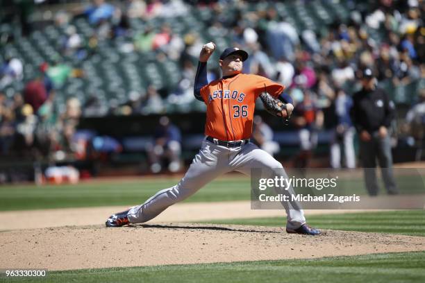 Will Harris of the Houston Astros pitches during the game against the Oakland Athletics at the Oakland Alameda Coliseum on May 9, 2018 in Oakland,...