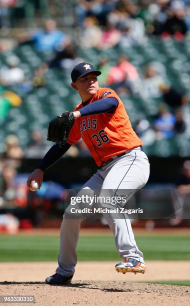 Will Harris of the Houston Astros pitches during the game against the Oakland Athletics at the Oakland Alameda Coliseum on May 9, 2018 in Oakland,...