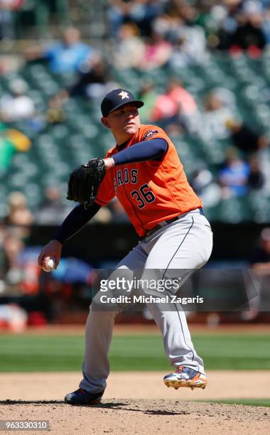Will Harris of the Houston Astros pitches during the game against the Oakland Athletics at the Oakland Alameda Coliseum on May 9, 2018 in Oakland,...
