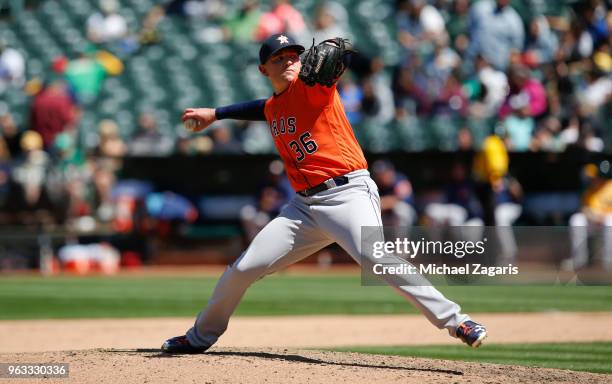 Will Harris of the Houston Astros pitches during the game against the Oakland Athletics at the Oakland Alameda Coliseum on May 9, 2018 in Oakland,...