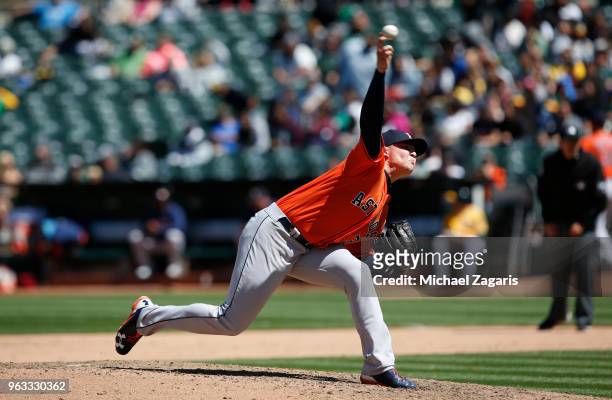 Will Harris of the Houston Astros pitches during the game against the Oakland Athletics at the Oakland Alameda Coliseum on May 9, 2018 in Oakland,...