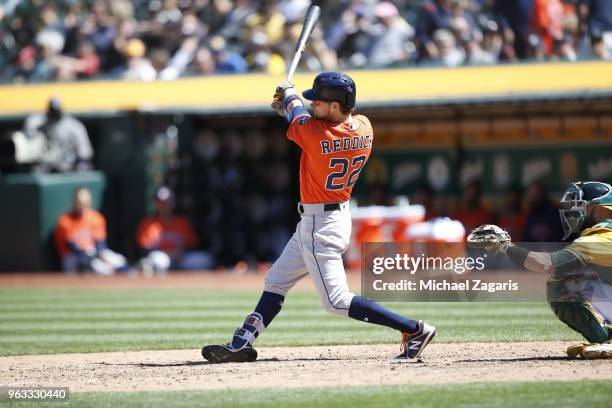 Josh Reddick of the Houston Astros bats during the game against the Oakland Athletics at the Oakland Alameda Coliseum on May 9, 2018 in Oakland,...