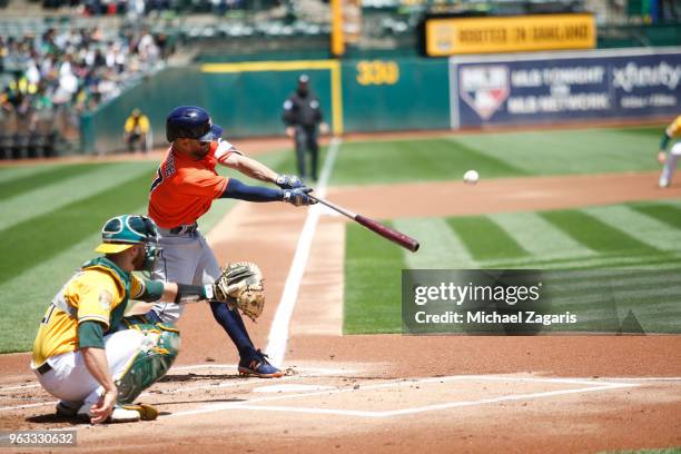 Jose Altuve of the Houston Astros bats during the game against the Oakland Athletics at the Oakland Alameda Coliseum on May 9, 2018 in Oakland,...