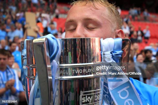 Jack Grimmer of Coventry City kisses the trophy during the Sky Bet League Two Play Off Final between Coventry City and Exeter City at Wembley Stadium...