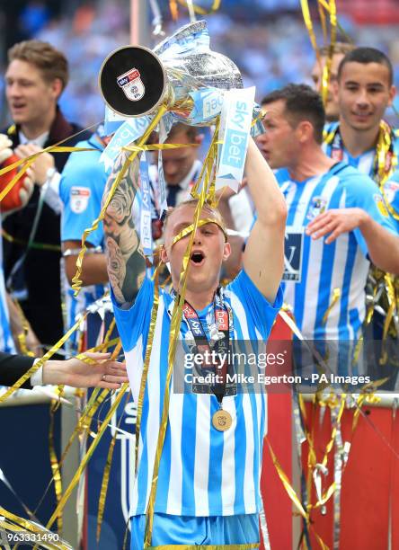 Coventry City's Jack Grimmer celebrates with the trophy after the Sky Bet League Two Final at Wembley Stadium, London.