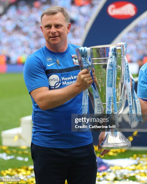 Mark Robins manager of Coventry City celebrates with the trophy after the Sky Bet League Two Play Off Final between Coventry City and Exeter City at...