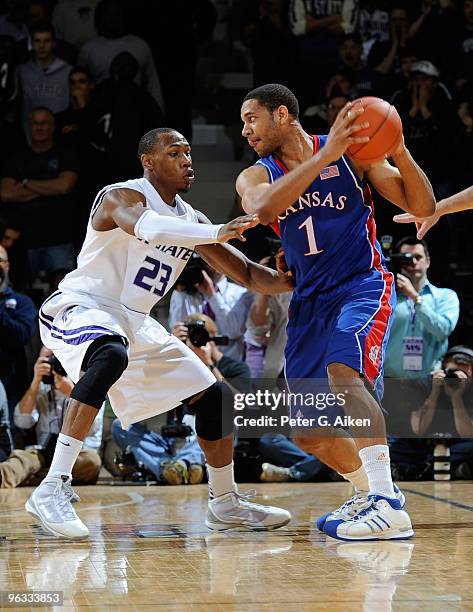 Forward Dominique Sutton of the Kansas State Wildcats pressures guard Xavier Henry of the Kansas Jayhawks in the second half on January 30, 2010 at...