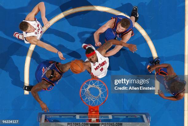 Chris Wilcox of the Detroit Pistons goes to the basket against Al Harrington and David Lee of the New York Knicks during the game on January 16, 2010...