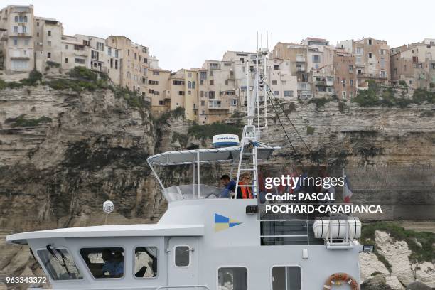 French Ecology Minister Nicolas Hulot stands on a boat with President of the Corsica Executive council Gilles Simeoni and Southtern Corsica Prefect...