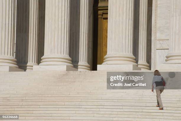 woman walking up steps of us supreme court - law student stock pictures, royalty-free photos & images