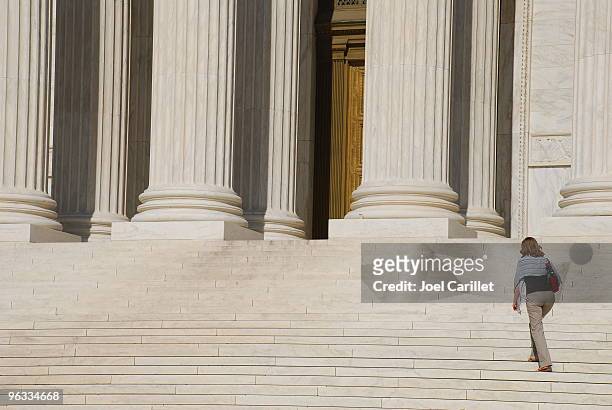 woman walking up steps of us supreme court - usa:s högsta domstol bildbanksfoton och bilder
