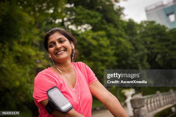 active senior woman enjoying a healthy lifestyle - 50 year old indian lady stock pictures, royalty-free photos & images