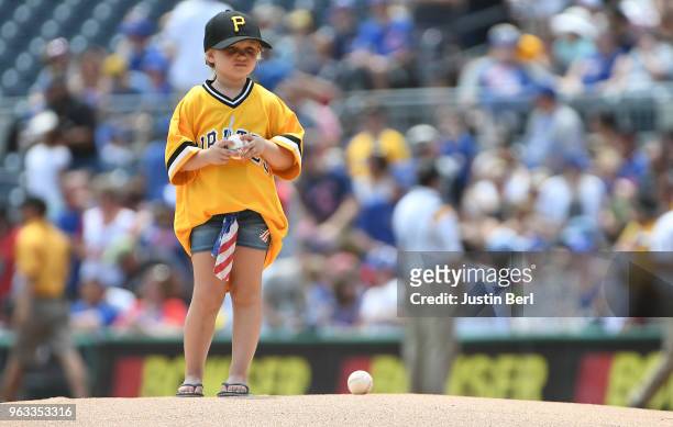 Young fan waits on the pitchers mound for Chad Kuhl of the Pittsburgh Pirates before the first inning during the game against the Chicago Cubs at PNC...