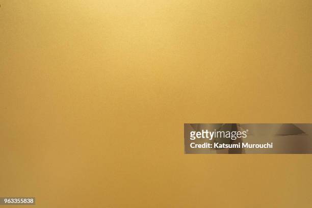golden texture background - gold coloured stock pictures, royalty-free photos & images