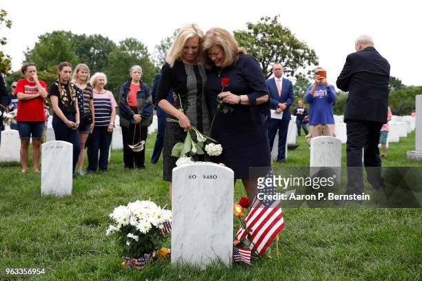 Secretary of Homeland Security Kirstjen Nielsen, embraces Karen Kelly, wife of White House Chief of Staff John Kelly, as they pay their respects to...