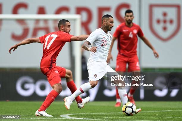 Ricardo Quaresma of Portugal competes for the ball with Elyes Skhiri of Tunisia during the international friendly football match against Portugal and...