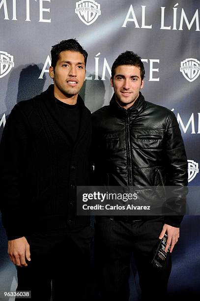 Ezequiel Garay and Gonzalo Higua'n attend "Edge of the Darkness" premiere at the Palafox cinema on February 1, 2010 in Madrid, Spain.