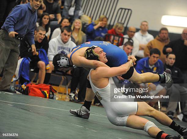 Robinson High School's Tim Fitzpatrick drives Westfield's Dylan Doty to the mat during their 171lb match. Fitzpatrick wins the match. Robinson's team...