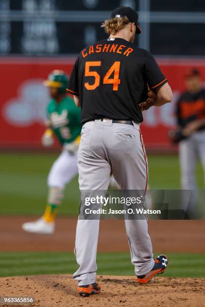 Khris Davis of the Oakland Athletics rounds the bases after hitting a three run home run off of Andrew Cashner of the Baltimore Orioles during the...