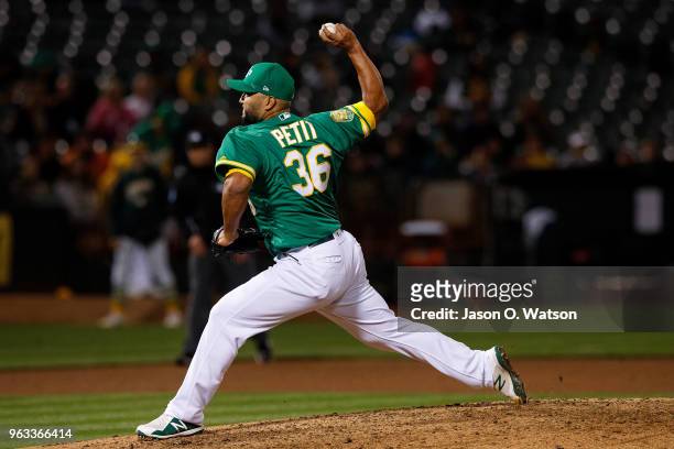 Yusmeiro Petit of the Oakland Athletics pitches against the Baltimore Orioles during the sixth inning at the Oakland Coliseum on May 4, 2018 in...