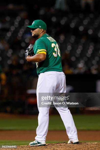 Yusmeiro Petit of the Oakland Athletics stands on the pitchers mound against the Baltimore Orioles during the sixth inning at the Oakland Coliseum on...