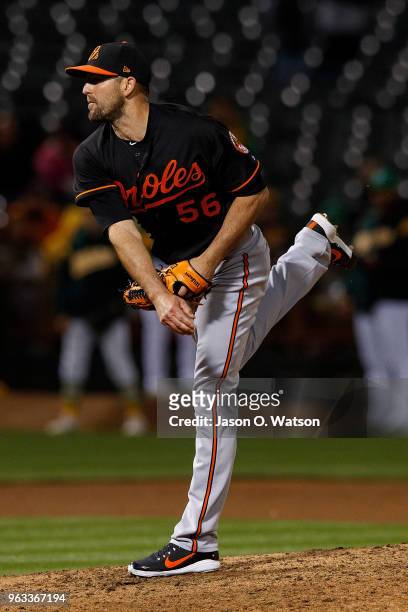 Darren O'Day of the Baltimore Orioles pitches against the Oakland Athletics during the seventh inning at the Oakland Coliseum on May 4, 2018 in...