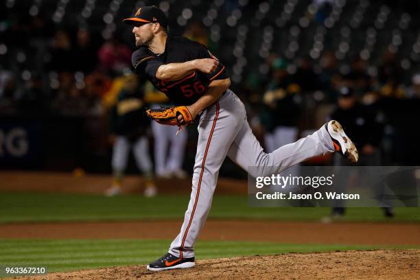 Darren O'Day of the Baltimore Orioles pitches against the Oakland Athletics during the seventh inning at the Oakland Coliseum on May 4, 2018 in...