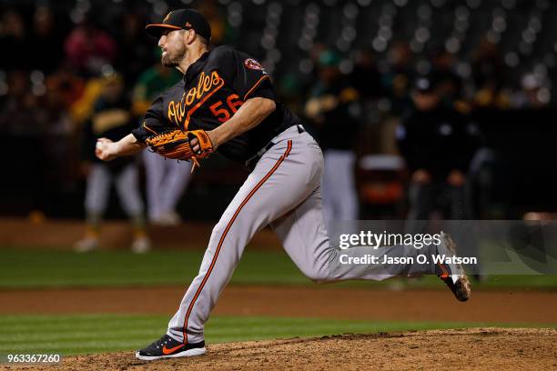 Darren O'Day of the Baltimore Orioles pitches against the Oakland Athletics during the seventh inning at the Oakland Coliseum on May 4, 2018 in...