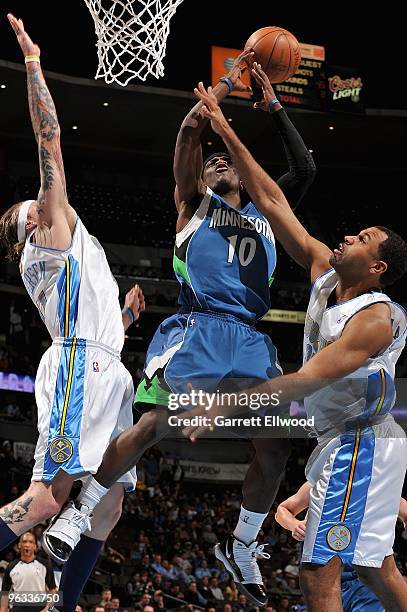 Jonny Flynn of the Minnesota Timberwolves goes to the basket against Chris Andersen and Malik Allen of the Denver Nuggets during the game on January...