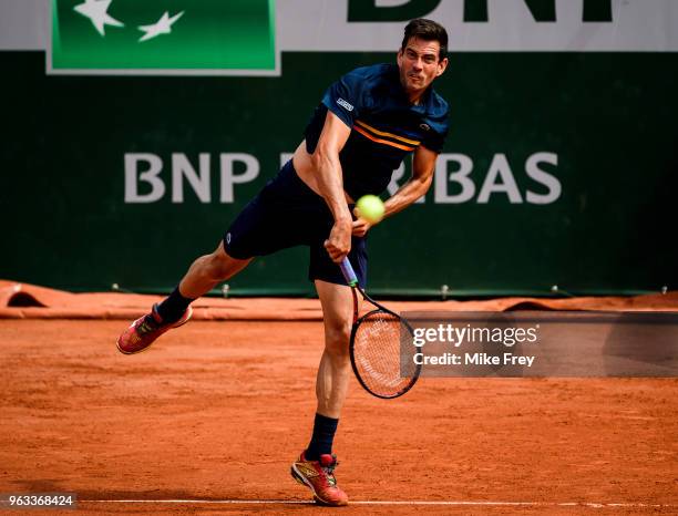 Guillermo Garcia-Lopez of Spain serves to Stan Wawrinka of Switzerland in the first round of the men's singles during the French Open at Roland...