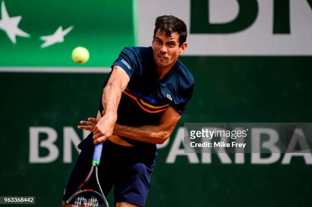 Guillermo Garcia-Lopez of Spain serves to Stan Wawrinka of Switzerland in the first round of the men's singles during the French Open at Roland...