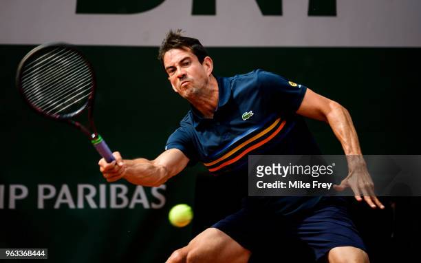 Guillermo Garcia-Lopez of Spain hits a forehand to Stan Wawrinka of Switzerland in the first round of the men's singles during the French Open at...