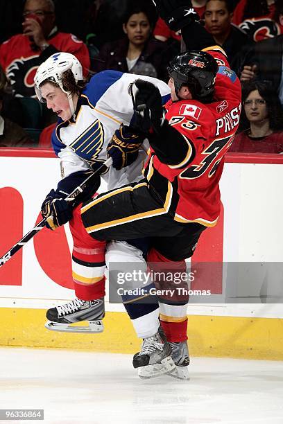 Eric Nystrom of the Calgary Flames collides against TJ Oshie of the St. Louis Blues on January 25, 2010 at Pengrowth Saddledome in Calgary, Alberta,...