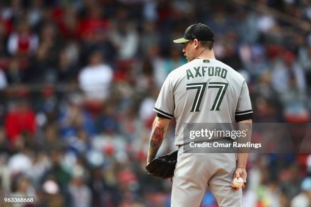 John Axford of the Toronto Blue Jays pitches in the bottom of the seventh inning of the game against the Boston Red Sox at Fenway Park on May 28,...