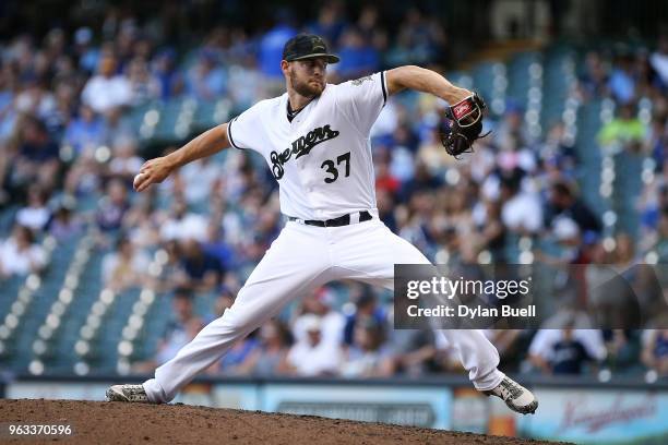Adrian Houser of the Milwaukee Brewers pitches in the ninth inning against the New York Mets at Miller Park on May 26, 2018 in Milwaukee, Wisconsin.