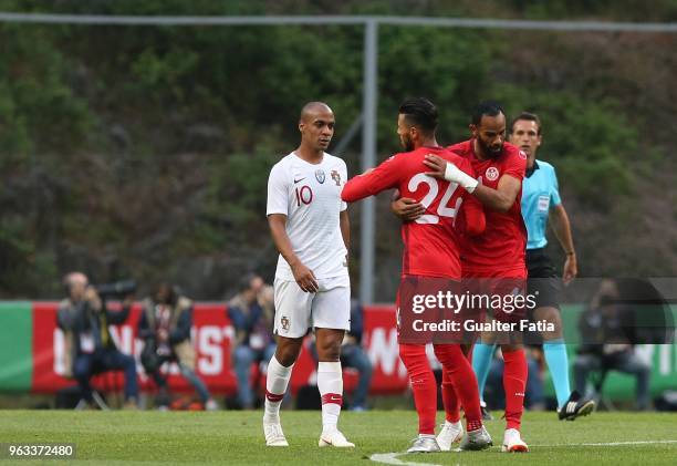 Tunisia forward Anice Badri celebrates with teammate Tunisia forward Saber Khalifa after scoring a goal during the International Friendly match...