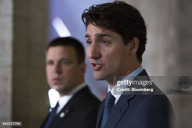 Justin Trudeau, Canada's prime minister, right, speaks as Juri Ratas, Estonia's prime minister, listens during a joint press conference on Parliament...