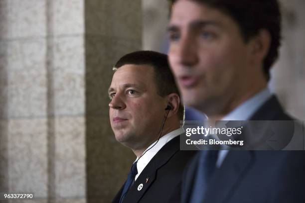 Juri Ratas, Estonia's prime minister, left, listens as Justin Trudeau, Canada's prime minister, speaks during a joint press conference on Parliament...